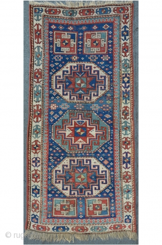 Antique Caucasian Kasak, 222 x 104 cm, three octagon medaillons with powerful memling guls on a star field....magic! Brilliant colors including a beautiful turquoise.         