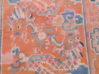 This is a striking example of an orange Tibetan ‘khaden’ rug depicting two dragons playing with the wish-fulfilling pearl. A khaden is a Tibetan sitting and sleeping rug, with a piece of  ...