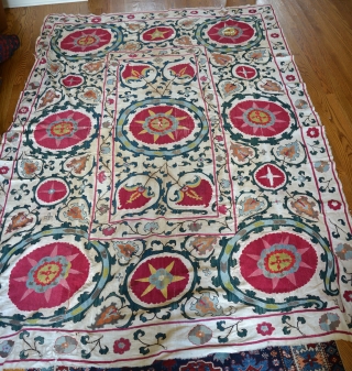 19th Century Uzbek Bukhara Suzani made of 8 almost equal panels stitched together vertically. Very good condition with very minor fraying and light stains. All natural colors include apricot, magenta, red, several  ...