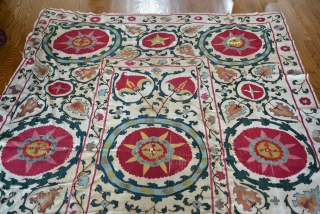 19th Century Uzbek Bukhara Suzani made of 8 almost equal panels stitched together vertically. Very good condition with very minor fraying and light stains. All natural colors include apricot, magenta, red, several  ...