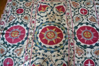 19th Century Uzbek Bukhara Suzani made of 8 almost equal panels stitched together vertically. Very good condition with very minor fraying and light stains. All natural colors include apricot, magenta, red, several  ...