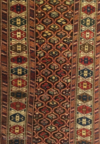 Daghestan Runner.  Circa 1850.  Stunning Caucasian runner exhibiting curvature to field design and unequal minor borders: a hallmark of tribal weaving. Daghestan border.   Some field motifs appearing three  ...