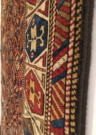 Daghestan Runner.  Circa 1850.  Stunning Caucasian runner exhibiting curvature to field design and unequal minor borders: a hallmark of tribal weaving. Daghestan border.   Some field motifs appearing three  ...