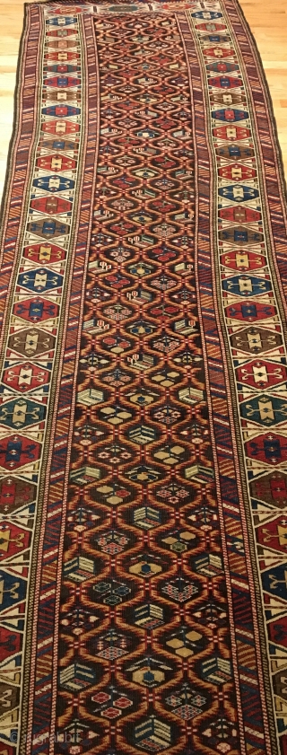 Daghestan Runner.  Circa 1850.  Stunning Caucasian runner exhibiting curvature to field design and unequal minor borders: a hallmark of tribal weaving. Daghestan border.   Some field motifs appearing three  ...