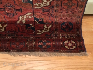 Tekke Main Carpet.  1st Half 19th Century.   Spacious red-purple field displays large rounded Tekke guls and secondary Gurbaghe guls connected by a fine line.  Cruciform star end borders  ...