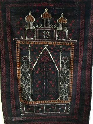 Kaudani Baluch Prayer Rug.  SE Persia.   Circa Antique.  Silk highlights in center. 

Full pile.  Few old invisible reweaves. (only visible on back).  54x38.  7 colors.  ...