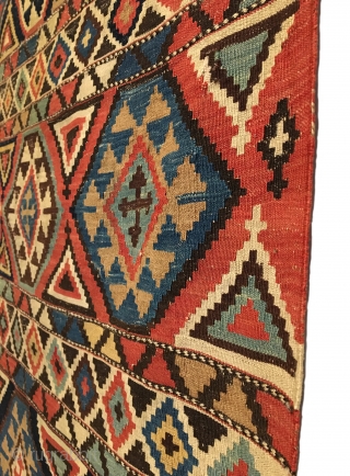Shirvan Kilim. 2nd Half 19th Century. A very colorful and finely woven early kilim. 6 x 5 large hexagonal rows are separated by cross tipped triangles. 7 Horizontal bands contain stepped diamonds.  ...
