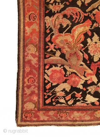 Antique Caucasian Karabagh Rug.  Circa Antique.  Flowers on a dark brown field. Repaired slits in right border as shown. Slight loss to top.  Even wear.  5 colors.   ...