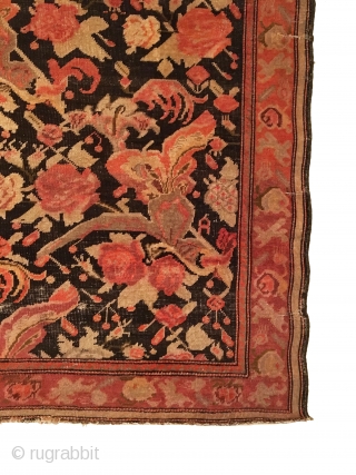 Antique Caucasian Karabagh Rug.  Circa Antique.  Flowers on a dark brown field. Repaired slits in right border as shown. Slight loss to top.  Even wear.  5 colors.   ...