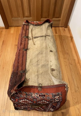 Antique Yomud Chuval. 19th Century. It is rare to find complete storage bags as many have been dismembered due to harsh conditions of seasonal migration. Sides feature a stepped hooked gul. Rear  ...