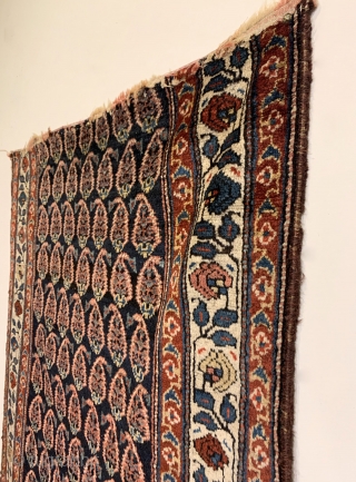 Antique Persian Kurdish Runner. Circa 1910. Alternating rows of glowing boteh sit on a soft-silky indigo field. The boteh drawing and spacing is random suggesting it was woven in a tribal environment.  ...