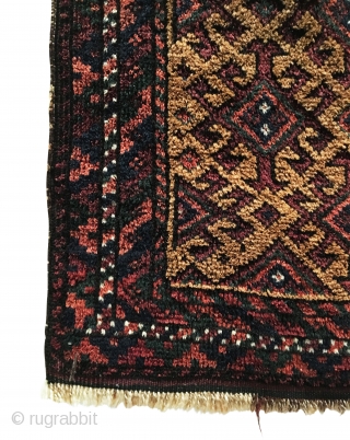 Antique Baluch Small Rug. Late 19th Century. Hooked diamonds float on camel field. Excellent condition. Lower right corner kilim reweave. Full pile. Inscription in white, across top kilim end? 1’6 x 2’6.  ...