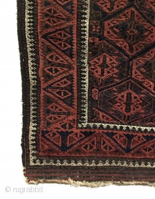 Antique Baluch Rug. Timuri, Sangtshuli. 3rd Quarter 19th Century. This is an early collectors rug. The main border consists of alternating triangles of tulip like three stemmed plants. Bright white medakhyl (medical)  ...