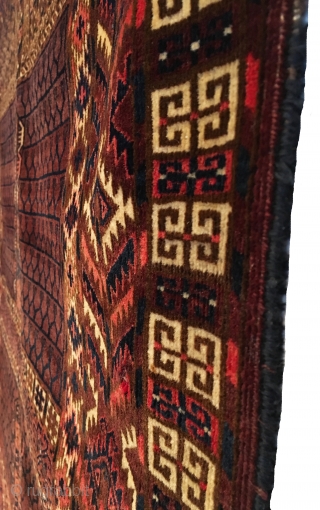 Antique Yomud Ensi. Subtle purple-brown field. Folded kilim top with remnants of woven hanging chords. Full Pile.  Very good condition besides one tiny hole. 4’2 x 4’11. Carefully hand washed.  