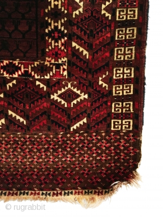 Antique Yomud Ensi. Subtle purple-brown field. Folded kilim top with remnants of woven hanging chords. Full Pile.  Very good condition besides one tiny hole. 4’2 x 4’11. Carefully hand washed.  