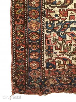 Antique Kurdish Long Rug. Last Quarter 19th Century. 21 Colorful Rows of archaic dragon motifs. Some pile loss to top left. Old darning visible across bottom. Original braided top and selvage. 3’11  ...