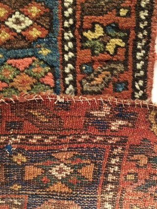 Antique Kurdish Long Rug. Last Quarter 19th Century. 21 Colorful Rows of archaic dragon motifs. Some pile loss to top left. Old darning visible across bottom. Original braided top and selvage. 3’11  ...