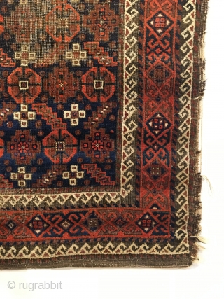 Antique Baluch Rug.  Northeast Iran.  2nd Half 19th Century.  Serrated leaves enclose stepped medallions on blue ground field.  Loss to selvage.  One area of localized wear.   ...