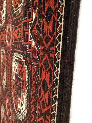 Salar Khani Baluch Rug.  North-east Persia.  Circa 1880. Turkmen gols float on a madder and slightly corroded embossed brown field.  Mint condition.  5 colors.  67 x 35.  ...