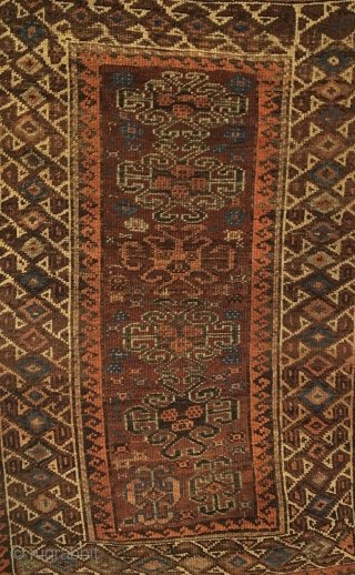 Baluch Rug. Symmetrically knotted group. Hooked medallions float on madder field surrounded by bird pinwheel border.  Last Quarter 19th Century.  Beautiful kilim ends.  6 colors.  51 x 31.5.  ...