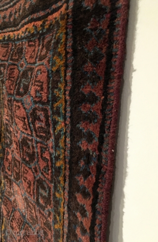 Small Afghan Baluch Rug.  Circa Antique.  5x2 gul patterned field.  Full lustrous pile.  One small hole.  5 colors.  40.5 x 22.  Clean and hand washed. 