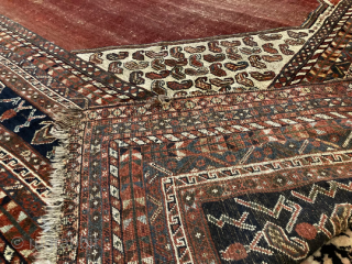 11’4” x 9’10” Antique Quashqi Boteh Main Rug [130] 
Antique Quashqi main carpet. With 16 borders, this piece features an abrashed cranberry field and ivory boteh filled corner brackets. In great condition,  ...