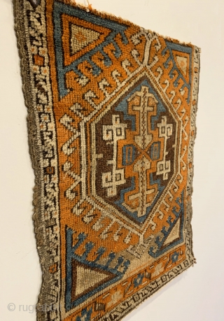 Early Yastik Fragment. Central Anatolia. 2nd Half 19th Century. Abrashed field with saturated colors including strong purple and turquoise. Compare the rendering of center medallion arrows and joined ivory hooks to plates  ...