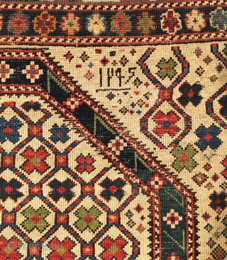 Antique Shirvan Prayer Rug. White Ground. Dated 1295 = Circa 1879. Hexagonal lattice enclosing colorful small flower petals. Note: Field design continued above pentagonal mihrab. Very good condition considering age with even  ...