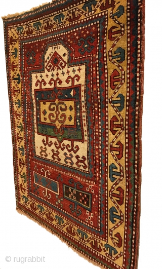 Early Tribal Kazak Prayer Rug. Inscribed Date 1261 = Circa 1845. Very good condition considering age with even wear. No repairs. 7 saturated colors. 2’2 x 3’11. Delicately hand washed.

Note the large  ...