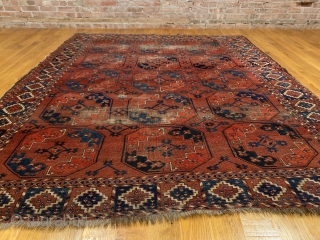 Antique Ersari Nomadic Main Carpet. Mid 19th Century. 15 large octagonal guls in blue and orange float on glowing madder red field. Star tipped diamond gols within main gul are also woven  ...