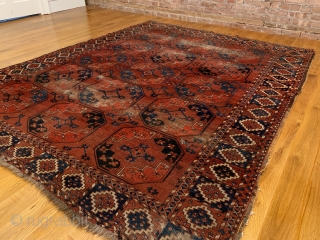 Antique Ersari Nomadic Main Carpet. Mid 19th Century. 15 large octagonal guls in blue and orange float on glowing madder red field. Star tipped diamond gols within main gul are also woven  ...