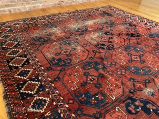 Antique Ersari Nomadic Main Carpet. Mid 19th Century. 15 large octagonal guls in blue and orange float on glowing madder red field. Star tipped diamond gols within main gul are also woven  ...