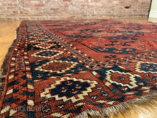 Antique Ersari Nomadic Main Carpet. Mid 19th Century. 15 large octagonal guls in blue and orange float on glowing madder red field. Star tipped diamond gols within main gul are also woven  ...
