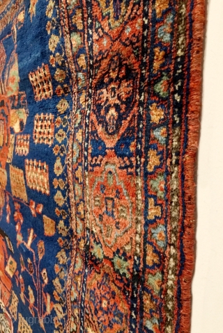 Antique Afshar Rug. 2nd Half 19th Century. Royal blue field with a central ‘Gul Farang’ design flanked by bunches of stylized blossoming branches and meandering outer vine, all within a terra-cotta cusped,  ...