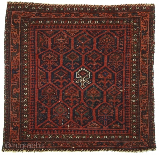 Belouch Bag Face, 1'7 x 1'7. Fresh find. Virtuoso weaving distinguished by the single ivory "plant motif" in the center. (See Jeff Boucher, Baluchi Woven Treasures, Plate 57.) Low glossy pile, some  ...