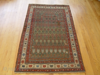 Antique Caucasian Karabagh prayer rug, size 2.11 x 4.11 ft.(59 x 119 cm), 100 % wool, beautiful green background.              