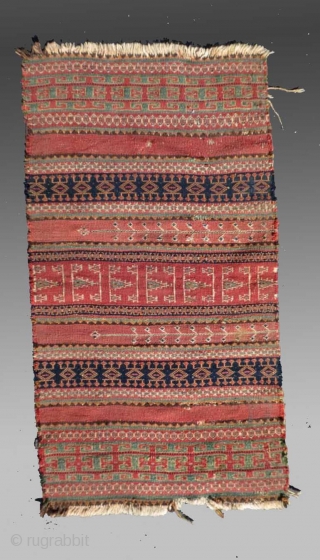 Baluch Kilim (fragment), SW Pakistan/SE Persia, 19th C., approx 1'7" x 3'1"

An older fragment exhibiting designs and colors not often seen in these flat weaves. 

See detail image for 'damage' in the  ...