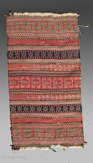 Baluch Kilim (fragment), SW Pakistan/SE Persia, 19th C., approx 1'7" x 3'1"

An older fragment exhibiting designs and colors not often seen in these flat weaves. 

See detail image for 'damage' in the  ...