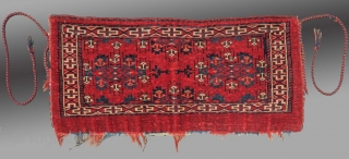 Yomut Group Torba, Central Asia, circa 1900 or before(?), 2'11" x 1'4"

Asymmetric knot open right

Cotton weft (white with some blue)

Good condition, no repair, complete with hanging cords and flat woven back

Saturated clear  ...