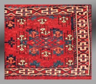 Yomut Group Torba, Central Asia, circa 1900 or before(?), 2'11" x 1'4"

Asymmetric knot open right

Cotton weft (white with some blue)

Good condition, no repair, complete with hanging cords and flat woven back

Saturated clear  ...