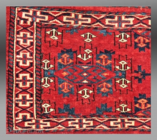 Yomut Group Torba, Central Asia, circa 1900 or before(?), 2'11" x 1'4"

Asymmetric knot open right

Cotton weft (white with some blue)

Good condition, no repair, complete with hanging cords and flat woven back

Saturated clear  ...