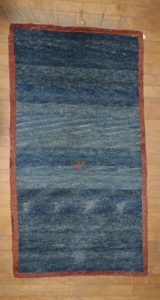 Small Indigo Khaden
beautifully abashed indigo field  with brick red border.
Tibet
Late 19th Century
27x50                    