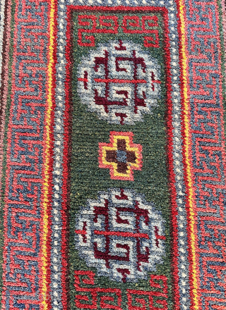 Here is an excellent example of a wang den, warp-faced back saddle carpet. This piece features a stunning green ground with two medallions and a single Tigma motif at the center. The  ...