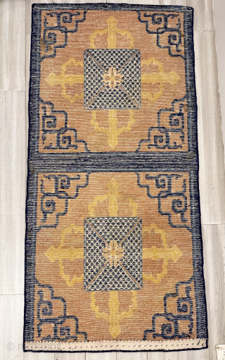 Nyingxia mat. An unusual rendering of the classical double Dorje motif overlayed with a geometric device that may be suggestive of Dragon scales. Lovely wool. Overcast edges
31 x 63 inches
19th century
China

please contact  ...