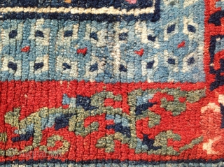 Small sitting carpet with great colour. The slightly crowded field is nicely complimented by the a light indigo Barley grain inner border. Beautifully drawn floral spandrels finish the outer border. Pile is  ...