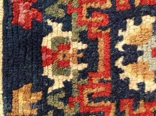 Small sitting carpet with great colour. The slightly crowded field is nicely complimented by the a light indigo Barley grain inner border. Beautifully drawn floral spandrels finish the outer border. Pile is  ...
