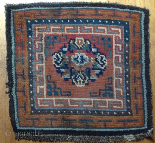 Sitting Carpet.
Archaic composition with bold border structure.
Goat hair foundation. Vegetal dyed wool pile.
32 x 32 inches
Village weaving
19th century
TIbet

* conditions: some minor discoloration. Requires minor restoration....Broken selvedge (visible on lower left side).two broken  ...