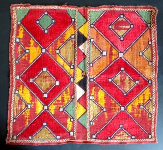 Indian embroidery. Cotton ground with silk embroidery in Phulkari technique. Cotton cross stitched border. Small hole in centre. 12 x 13 inches
Early 20th Century.         