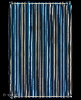 Blanket, 
Ivory Coast,
Cotton,
19th/early 20th Century,
Old European Collection,

105x70 in/267x179 cm. 
An exceptionally fine and early cloth displaying a particularly elegant ratio of vertical stripe proportion on a saturated indigo ground. This textile came  ...