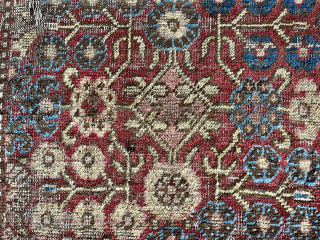 A fragment of a once much larger carpet from the oases of Khotan in Bes Gül design. Cut in Tibet to make a seat and sleeping mat (khaden). Probably from the first  ...